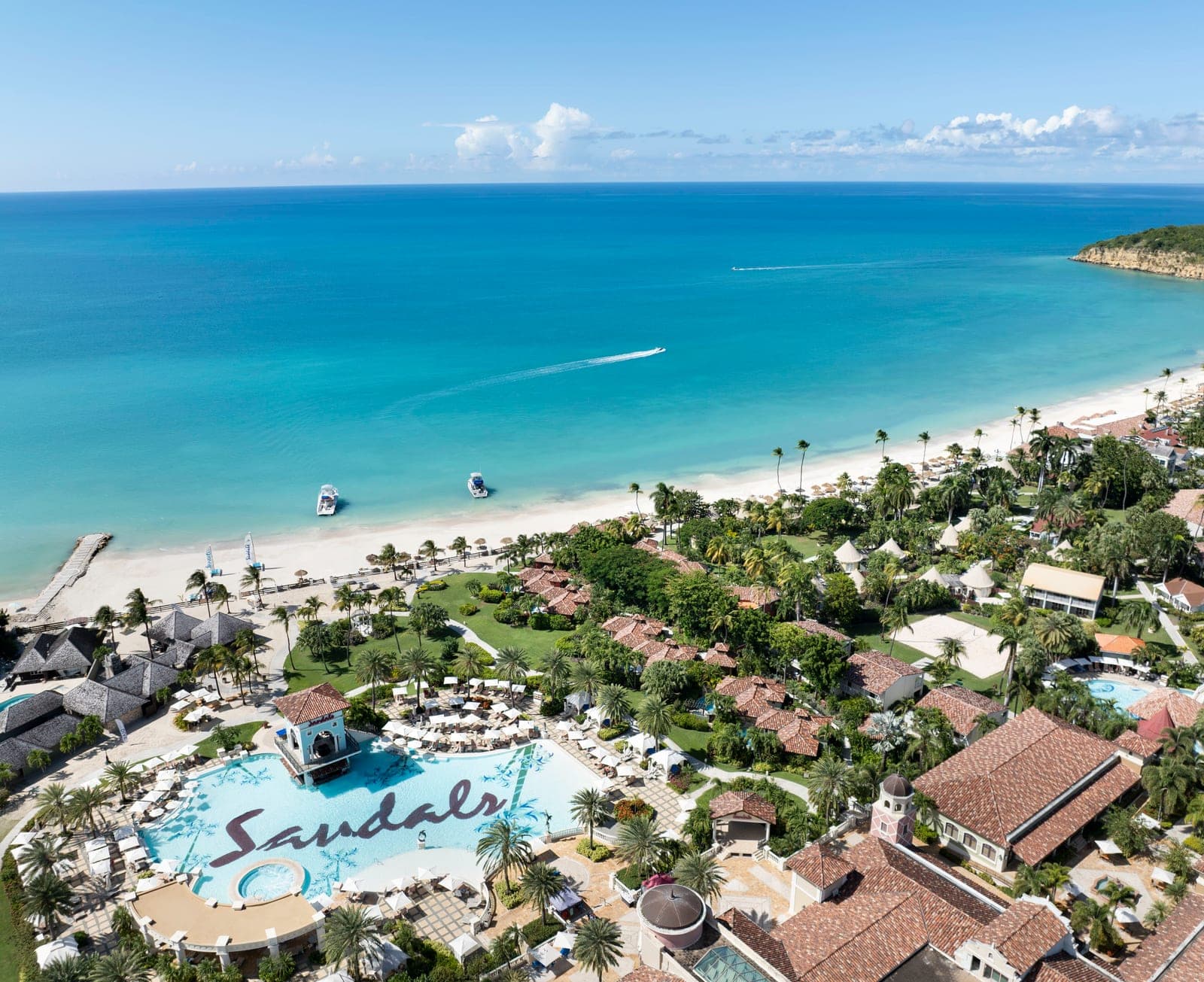Aerial drone view from the Mediterranean pool to the ocean at Sandals Grande Antigua