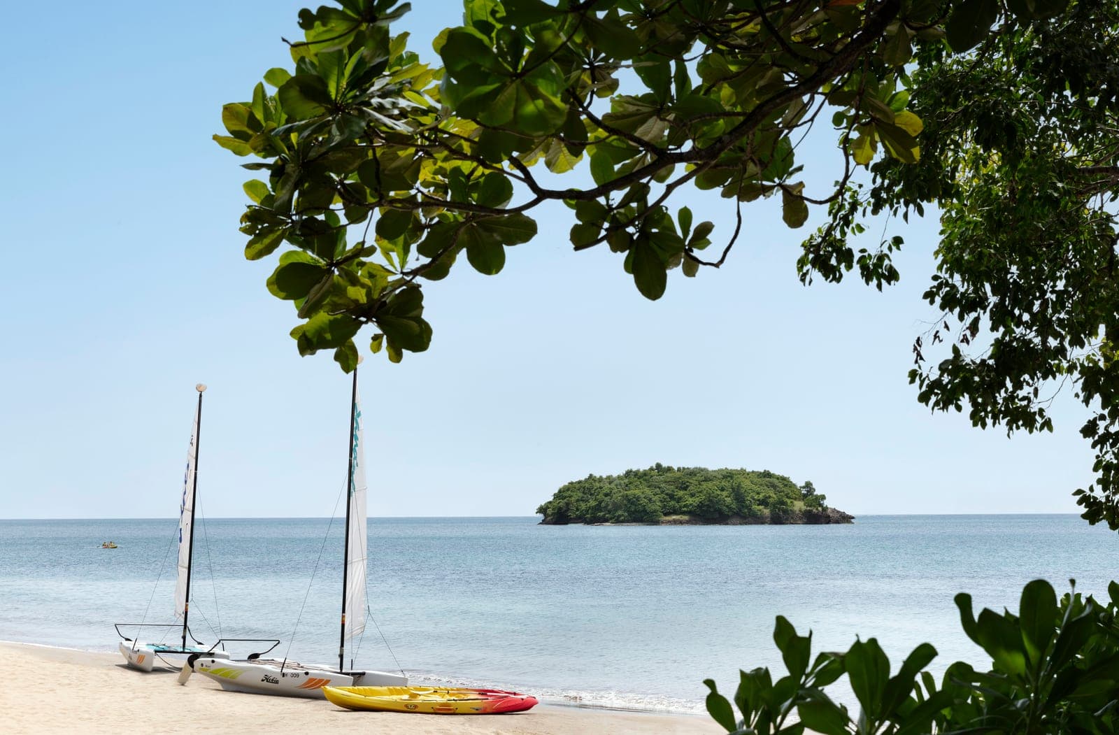 Hobie Cat and kayaks on the beach at Sandals Halcyon