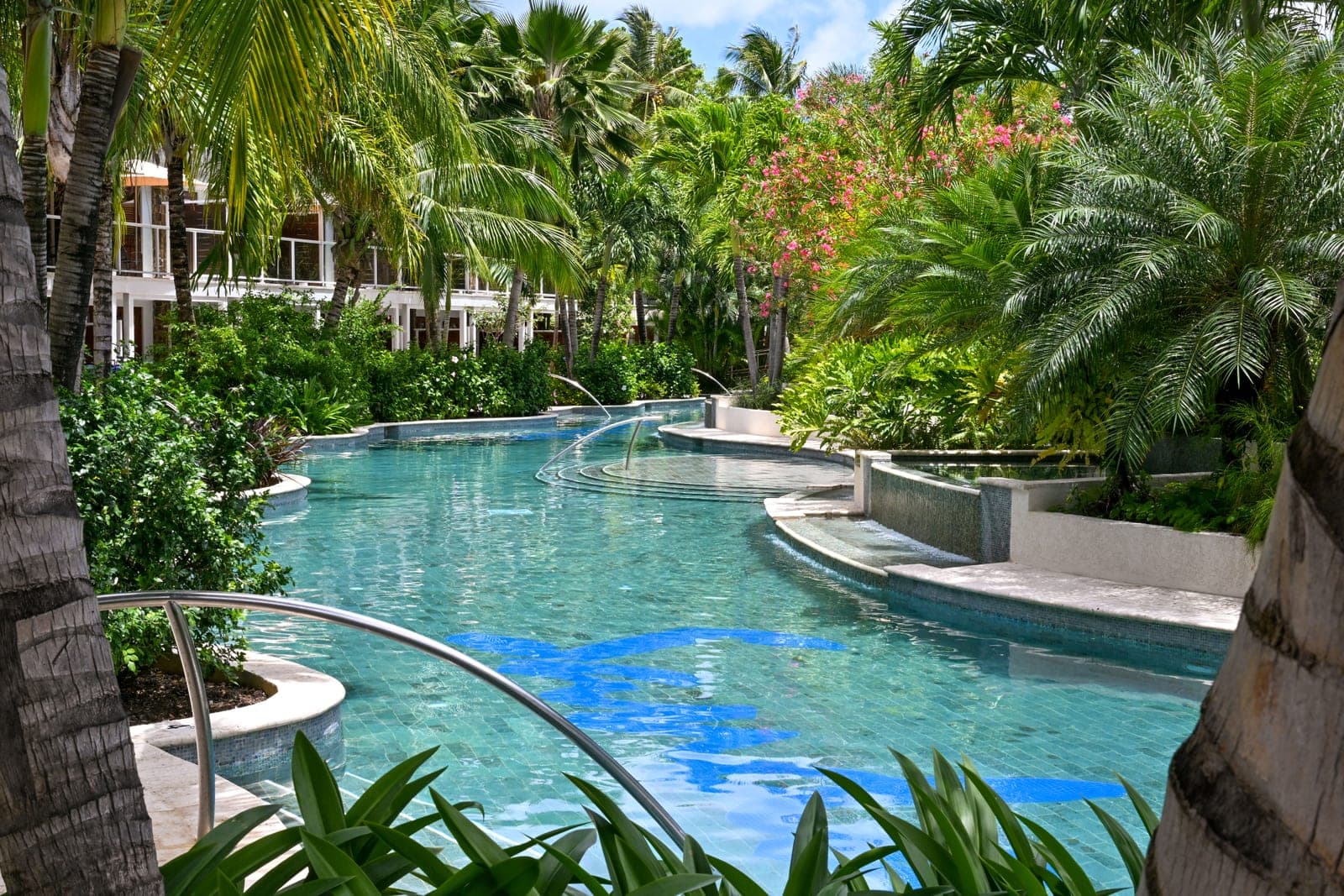 The Crystal Lagoon lazy pool at Sandals Halcyon, lined with palms
