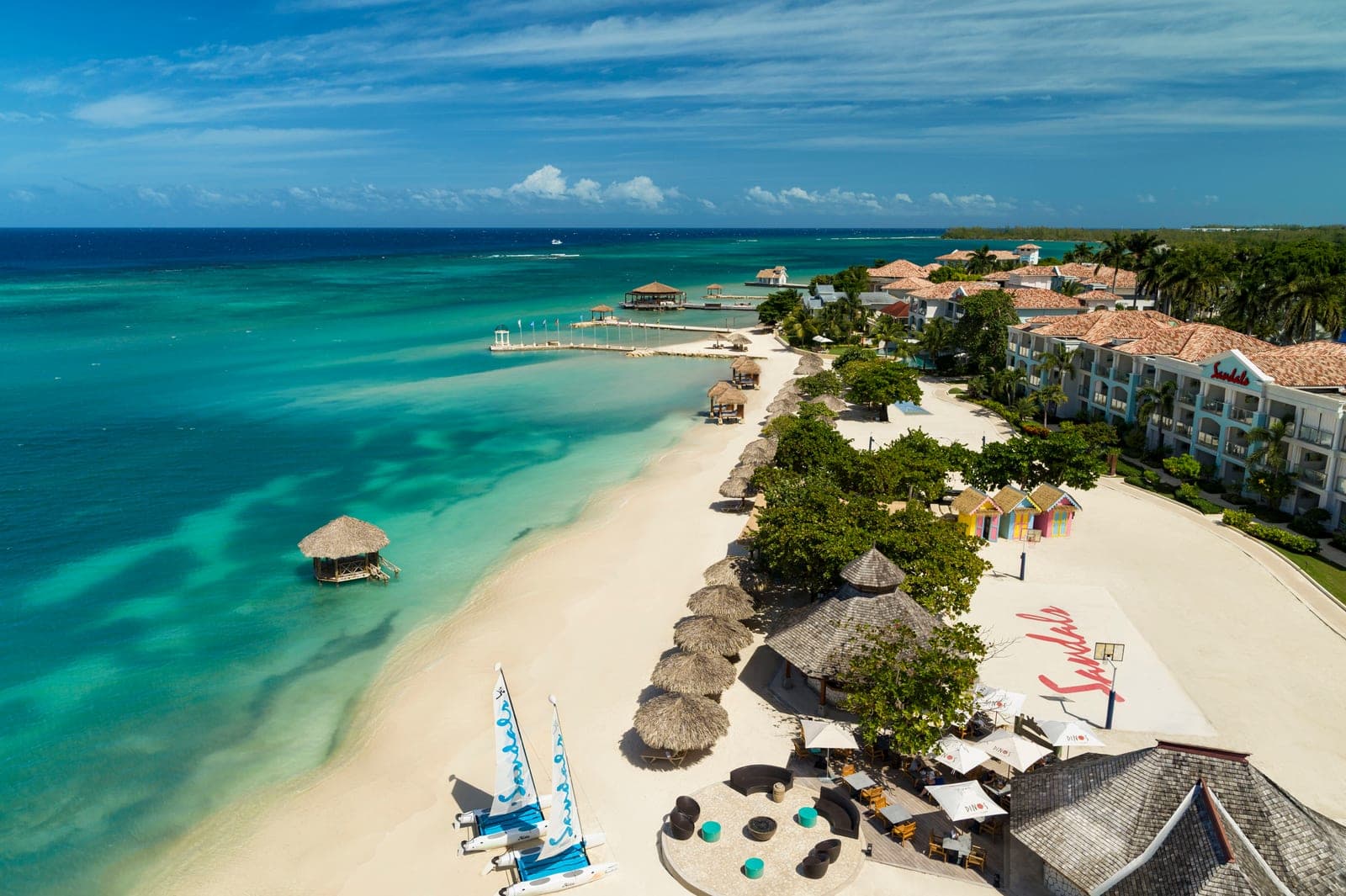 Aerial drone view of the beach and basketball court at Sandals Montego Bay