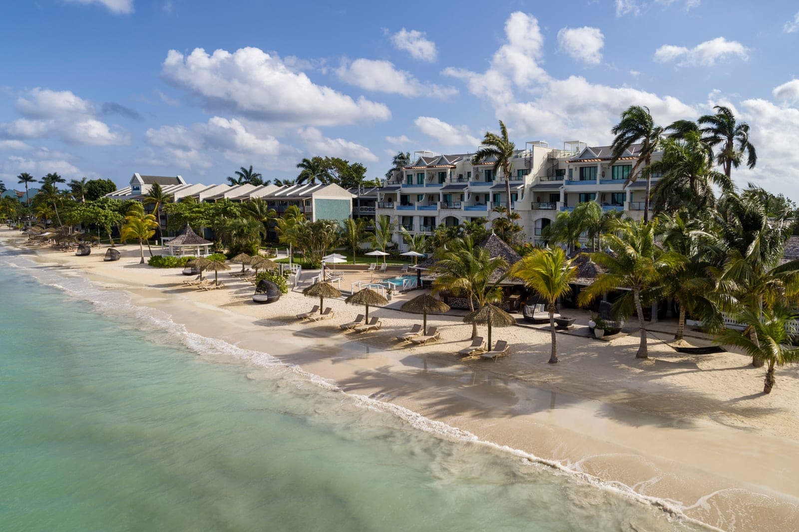 Aerial drone view of the Bamboo Grove building and beach at Sandals Negril