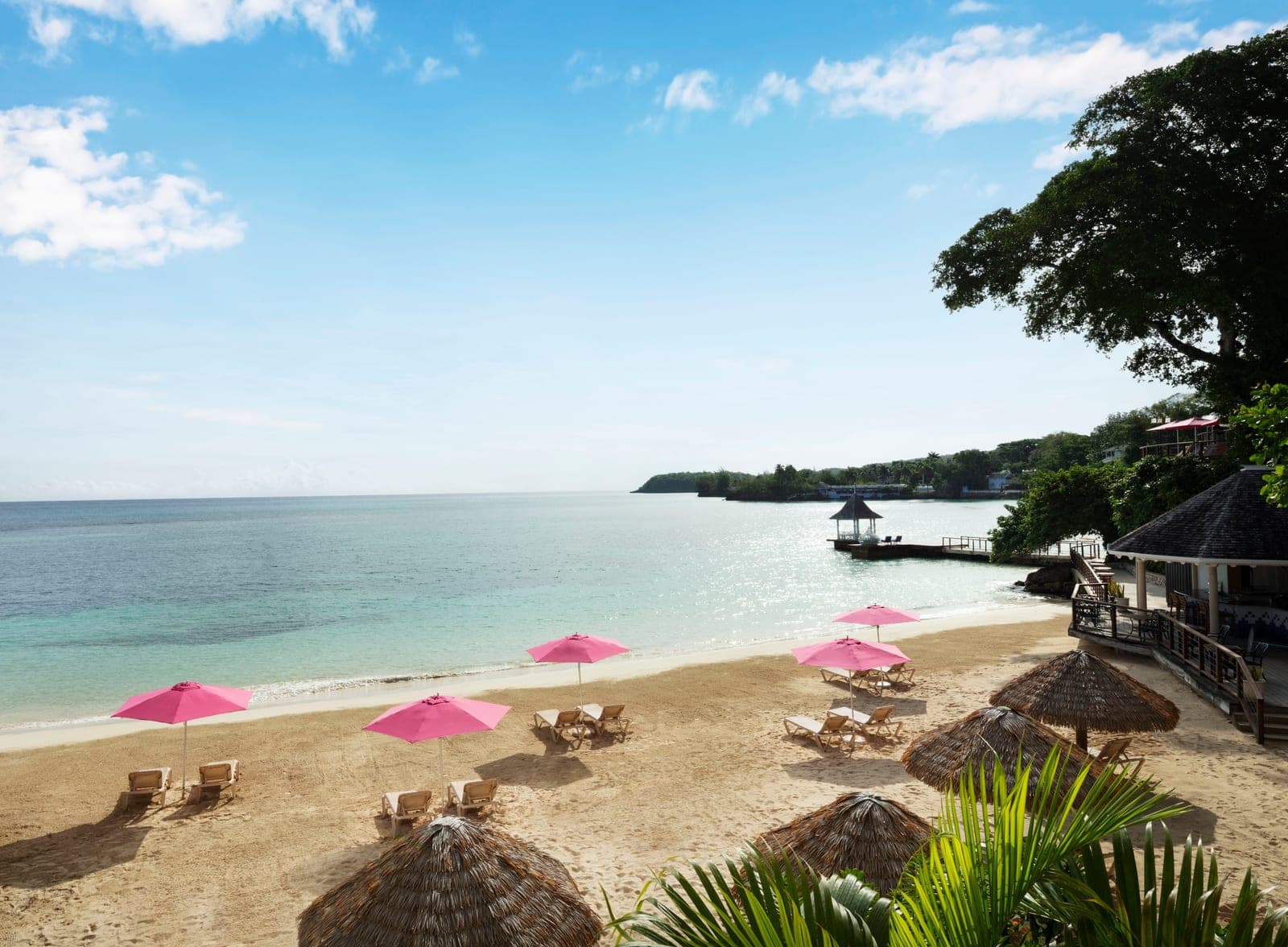 Sandals Royal Plantation beach with pink umbrellas, ocean view
