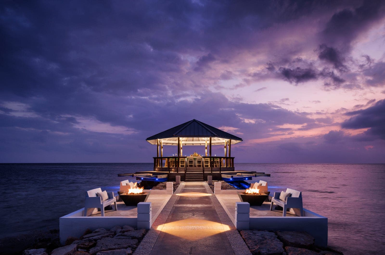 Latitudes overwater bar at Sandals South Coast, hammocks above the ocean