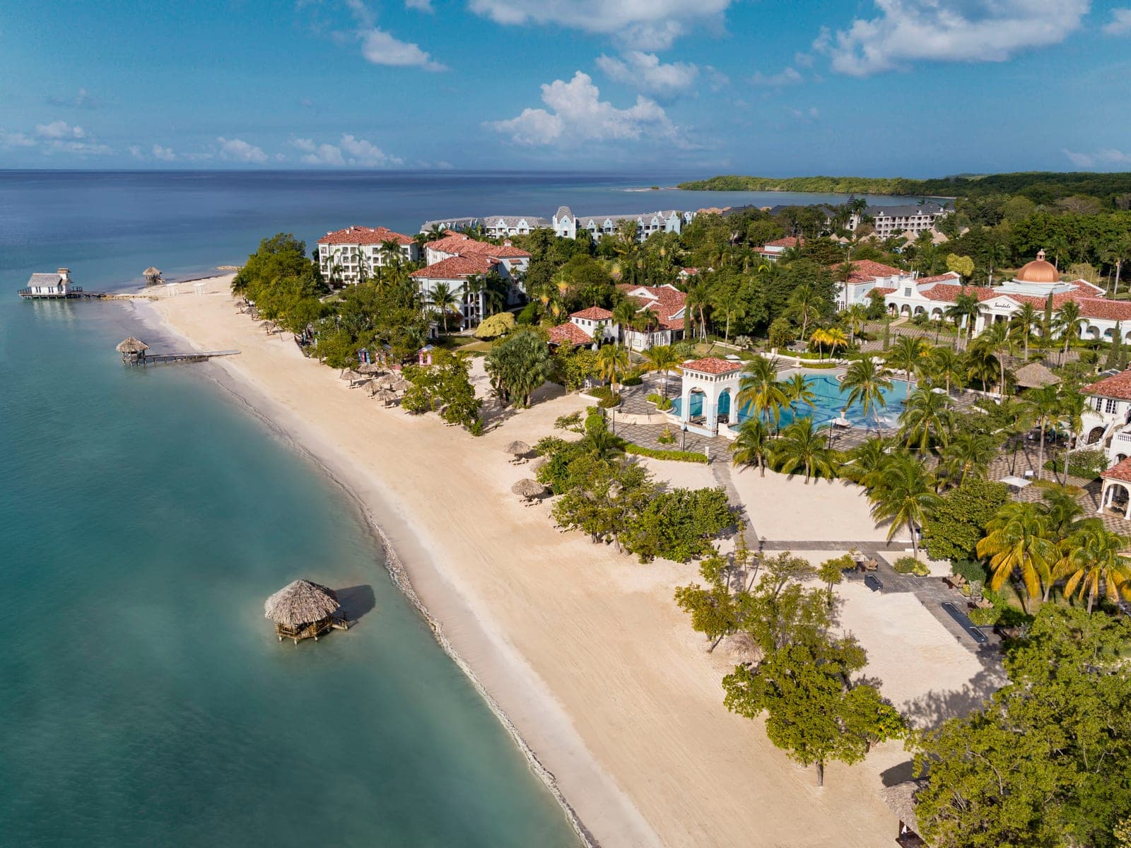 Aerial drone view of the beach and main pool at Sandals South Coast