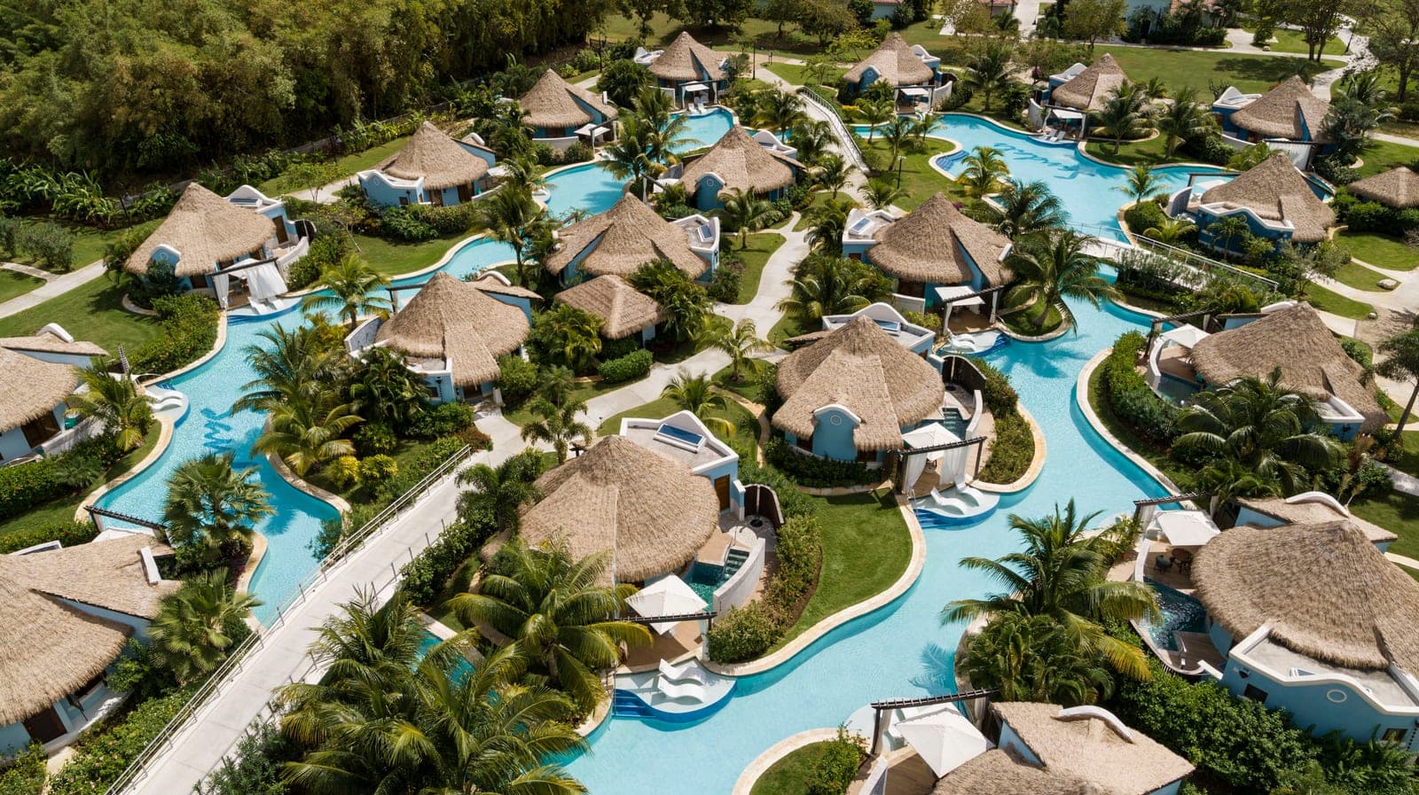 Aerial drone view of the Rondoval Village and its 1,000-foot swim-up pool at Sandals South Coast